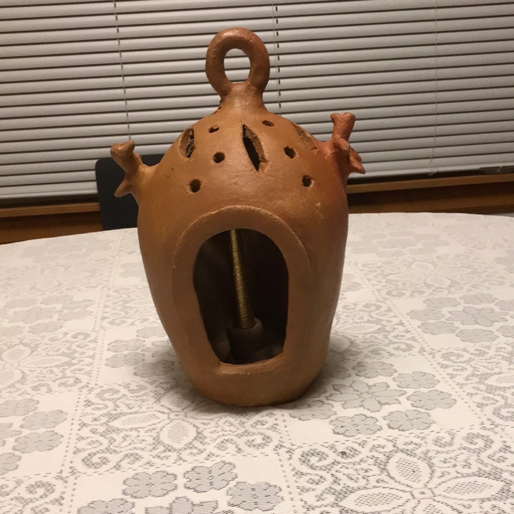 Decorative terracotta candle holder.